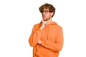 Young caucasian man isolated on green chroma background looking sideways with doubtful and skeptical expression.