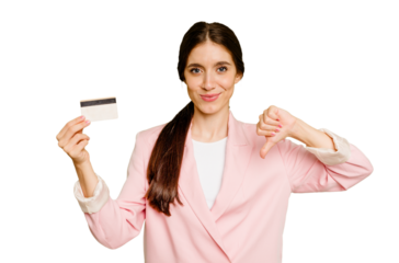 Business caucasian woman holding a credit card isolated showing a dislike gesture, thumbs down. Disagreement concept.