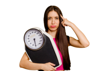 Young caucasian woman holding a scale isolated showing a disappointment gesture with forefinger.