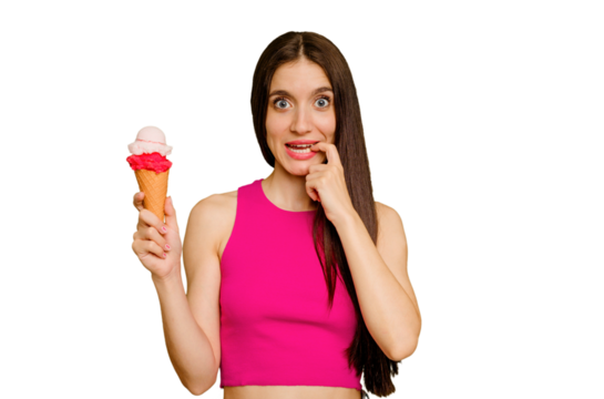 Young caucasian woman eating an ice cream isolated biting fingernails, nervous and very anxious.