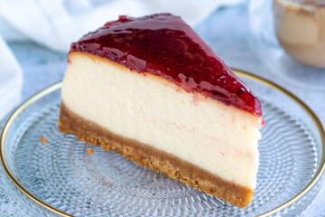 Cheese cake. Bakery products. Cheesecake with raspberry on a gray background. close up