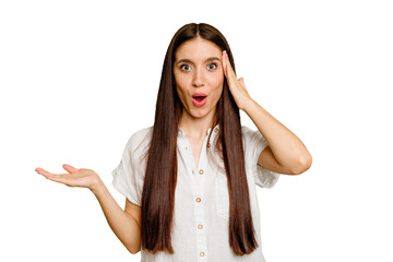 Young caucasian long hair woman isolated impressed holding copy space on palm.