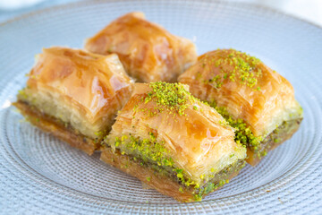 Pistachio baklava. Traditional Mediterranean cuisine delicacies. Baklava on gray background. close up