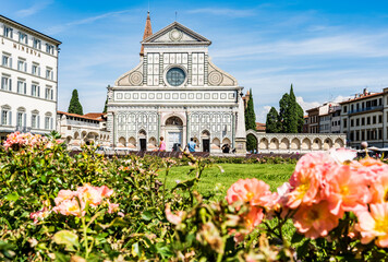 Exterior view of the Basilica of Santa Maria Novella in Florence, Italy, with its white marble facade in Renaissance style.