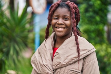 African american woman smiling confident standing at park