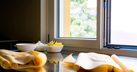 background of a pastry workshop, with some ingredients ready to make a cake