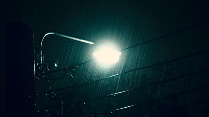 Raining Night and light. Rain Drops Falling in night at Bangkok Thailand in August raining season. Rain speedy at night. Shower rainfall. Rain falling. Rain Drop Street light. Weather forcast concept.