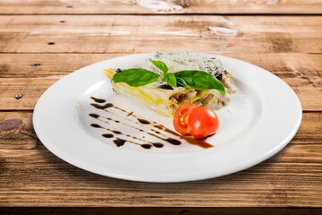 Tasty fresh lasagna dish on white plate