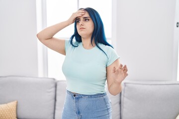 Young caucasian woman suffering dizzy standing at home