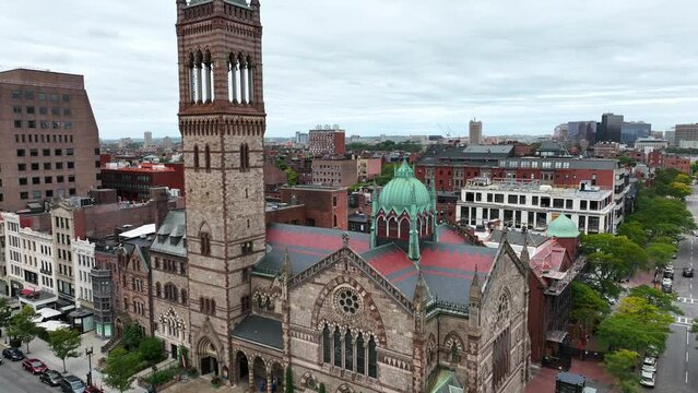 Trinity Church in Boston Massachusetts. Famous Freedom Trail tourist destination. Rising aerial reveal shot.