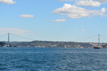 Fototapeta premium Istanbul water view, mansion, boats, sky and clouds