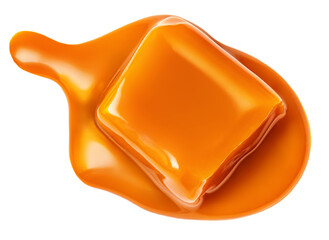 Caramel candy and flowing  caramel toffee sauce isolated on a white background. Top view. Flat lay