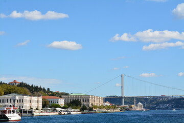 Fototapeta premium Istanbul water view, mansion, boats, sky and clouds