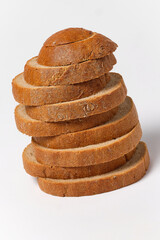 pieces of black bread on top of each other on a white background