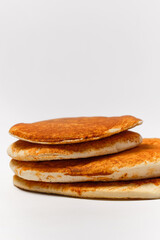 four pita breads on top of each other on a white background side view