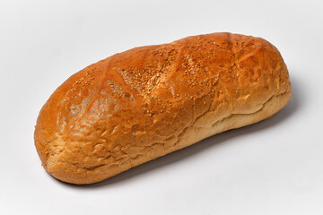 loaf of white bread with seeds on a white background, close view