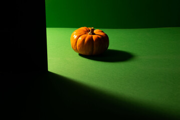 halloween pumpkin on a green background