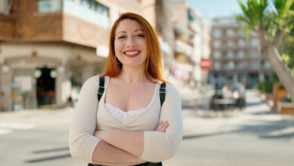 Young redhead woman  at street