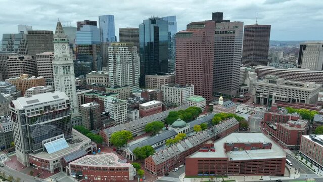 Cinematic aerial of Boston Massachusetts skyline. Historic buildings and modern skyscrapers. Famous tourist attractions and life in urban USA city.