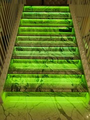 Beautiful green neon lights on the steps