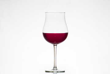 glass with red wine, tulip glass, winemaking, wineries, white background.