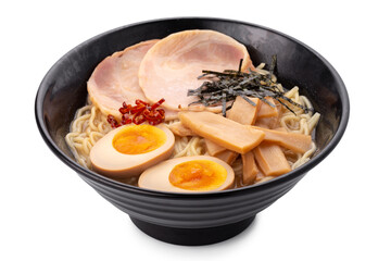 Asian ramen noodles soup with egg, pork and bamboo shoots in bowl is isolated on white background, Japanese cuisine