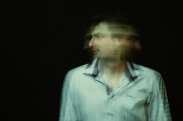 schizophrenic abstract blurry portrait of man with mental disorders and mental illnesses on dark...