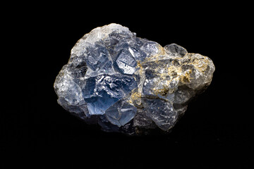 Real light blue celestine crystal cluster isolated on black background with no shadows
