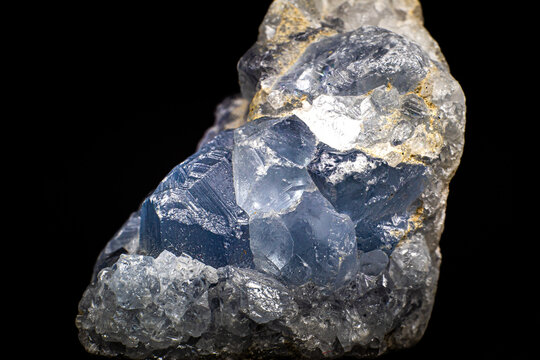 Real light blue celestine crystal cluster isolated on black background with no shadows