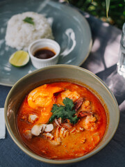 Asian soup 'Laksa' under palm tree at sunny day - 537012164