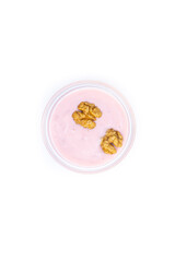 Walnuts and strawberry yoghurt, white background, isolated