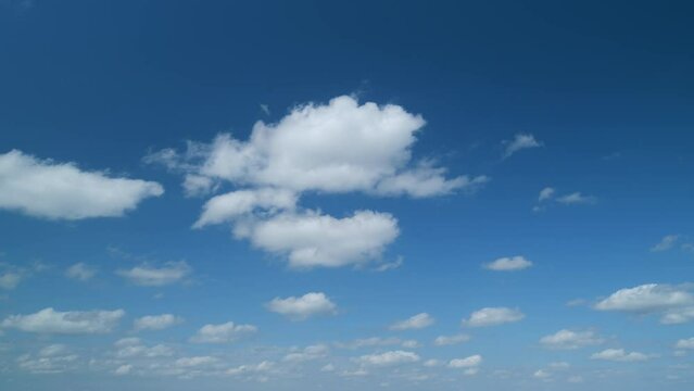 Sky with bautiful silky clouds. Puffy fluffy stratocumulus and cumulus clouds. Timelapse.