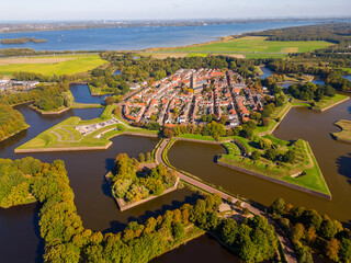 High angle Drone Point of View on the Fortified City of Naarden, North-Holland, Netherlands on sunny autumn day. Naarden was granted its city rights in 1300.