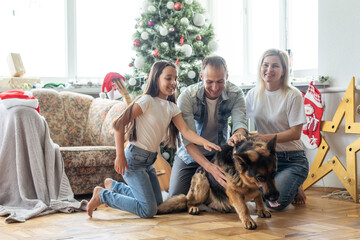 Christmas Family Portrait In Home Holiday Living Room, Kid and dog play, Present Gift Box, House Decorating By Xmas Tree