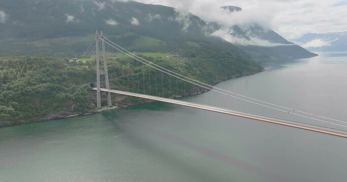 View From Above Of Hardanger Bridge Across Hardangerfjorden Connecting Ullensvang And Ulvik In Norway. aerial drone
