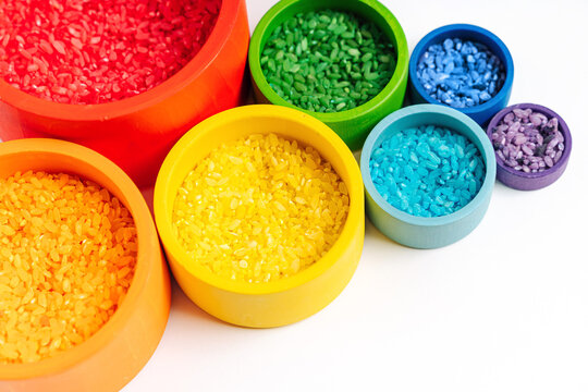 Bowls In Rainbow Colors With Colored Rice. Sensory Bin Toddler. Montessori Material. Learning Colors. Scooping And Pouring Activity For Kids. Games For Learning And Development Of Child