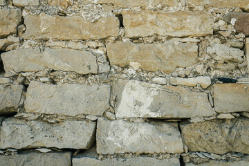 Background of old natural stone brick wall  