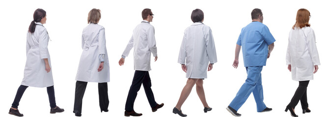 group of doctors in motion isolated on white