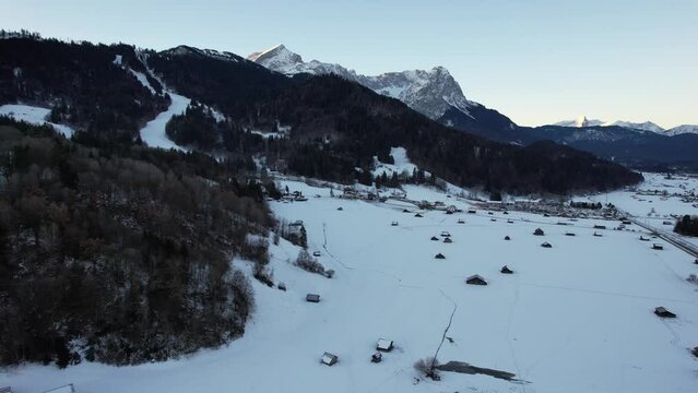 4K aerial of Garmisch Partenkirchen and the Zugspitz and Alpspitz in the alps of Bavaria, Germany, 2022