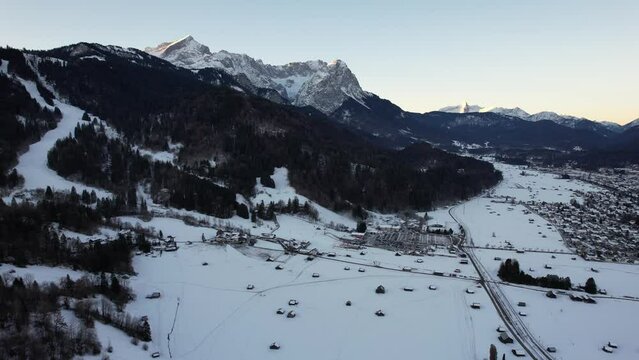 4K aerial of Garmisch Partenkirchen and the Zugspitz and Alpspitz in the alps of Bavaria, Germany, 2022