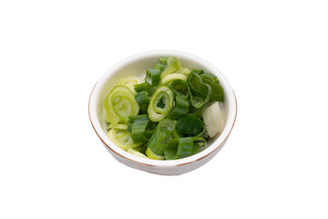 Green onion being trimmed on a white background