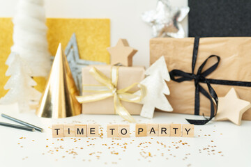 Christmas party time - confetti, gifts, tree, stars, glitter, ribbon. Party time lettering. New year 2023-2024.