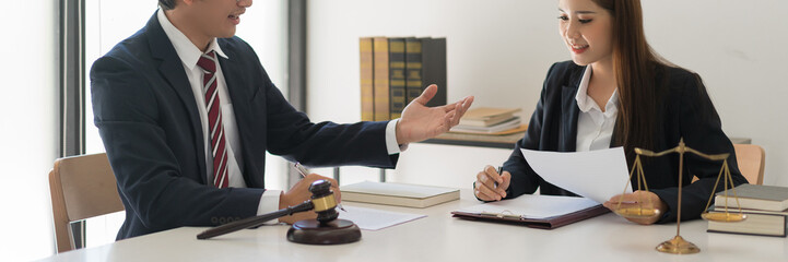 Legal and justice concept, Male lawyer explains contract about regulation to consultant in law firm