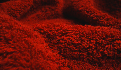 Texture of red soft terry towel textile.
