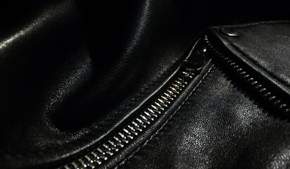 Black leather jacket details. Close-up.