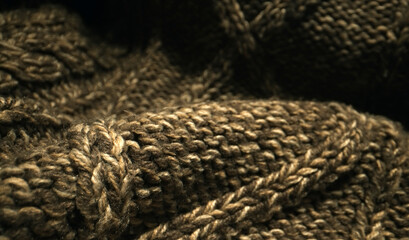 Knitted warm wool fabric texture. Close-up.