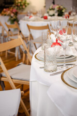 Beautiful wedding decoration. Banquet table setting and decoration. Flower decoration of wedding tables. Cutlery on the table.