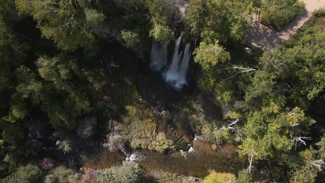 Drone descending towards waterfall in Spearfish Canyon