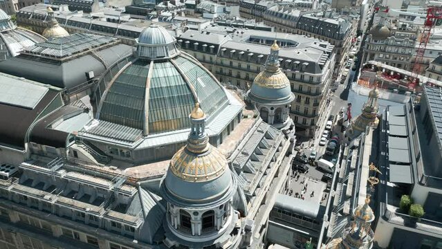 Drone flying over Printemps Haussmann luxury mall, Paris. Aerial top down