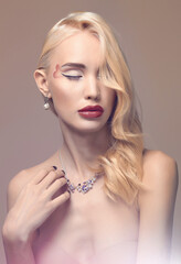 beautiful blond girl with makeup and jewelry